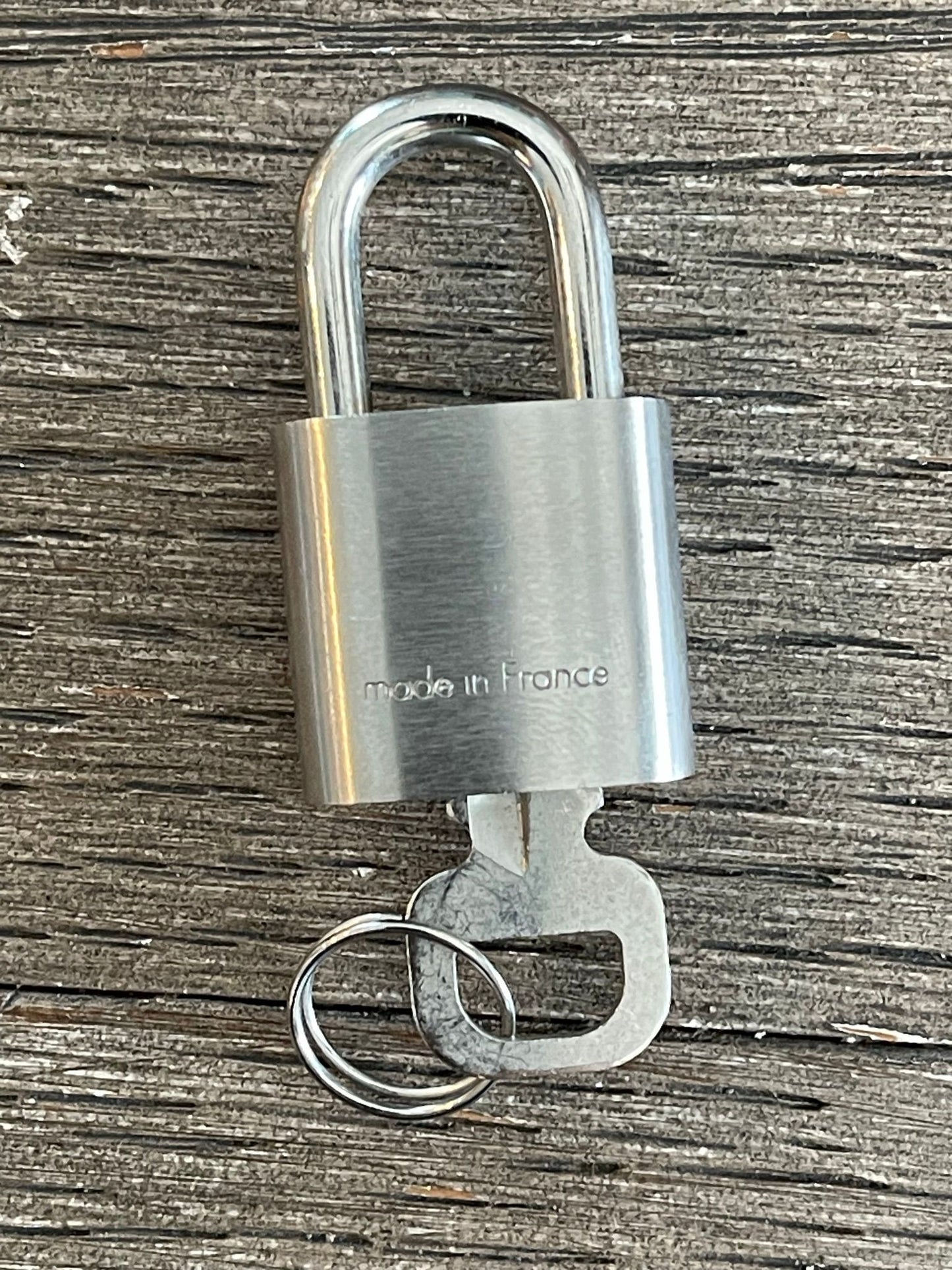 149. Louis Vuitton Silver Lock & Key #323