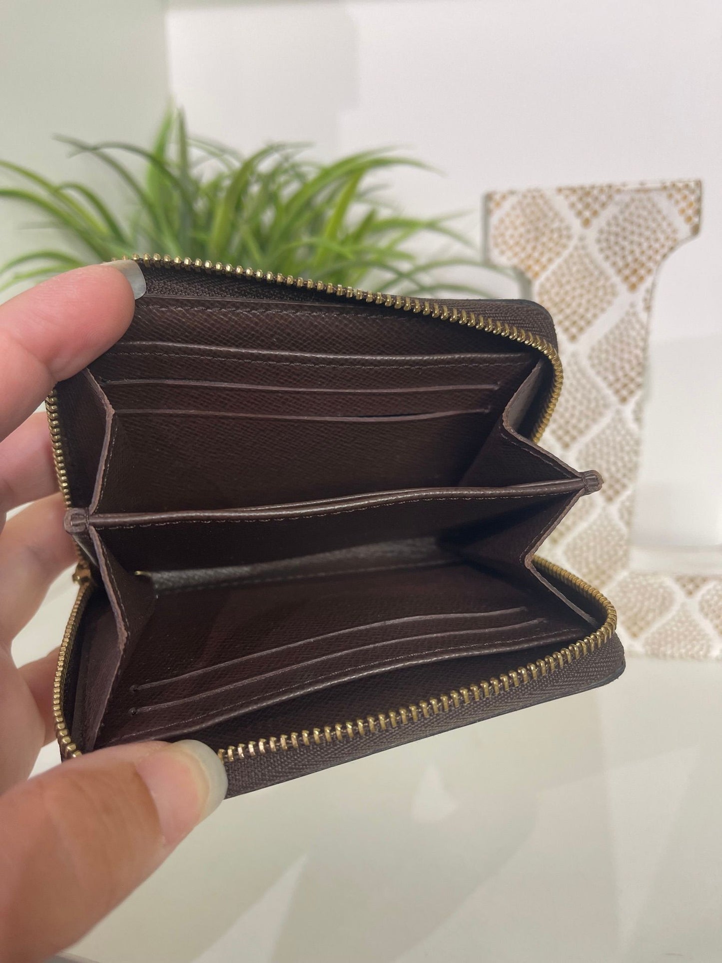16. Louis Vuitton Damier Ebene Zippy Card Holder