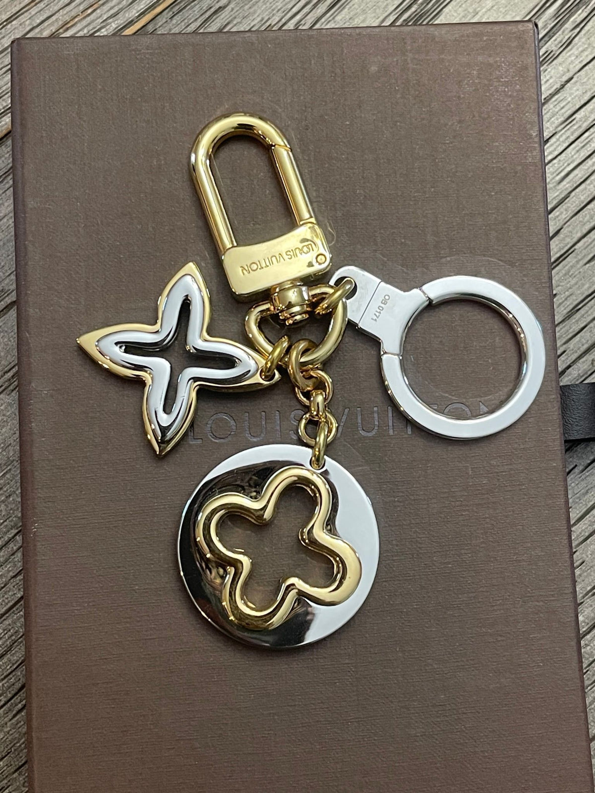17. Louis Vuitton Insolence Silver/Goldtone Bag Charm