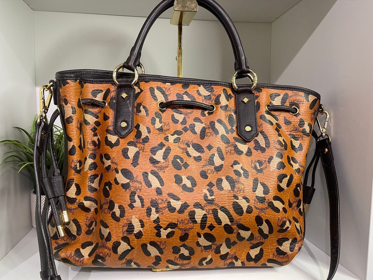 109. MCM Visetos Leopard Print Draw String Shoulder Bag