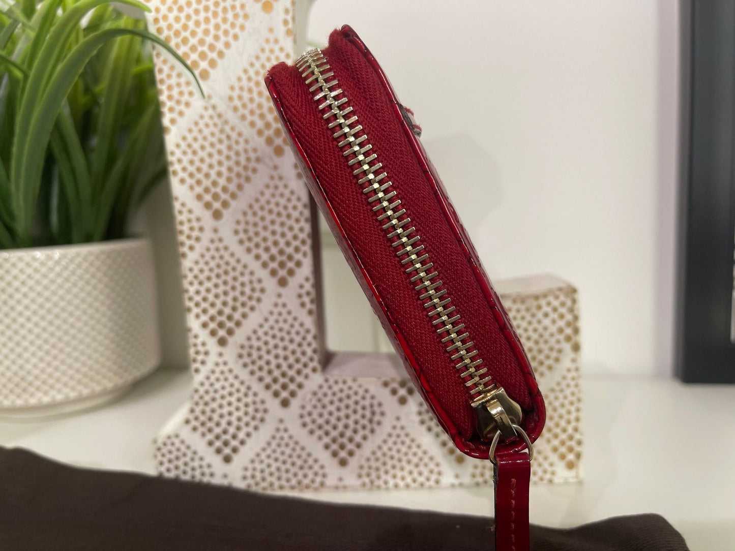 67. Gucci Red Patent Zippy Wallet