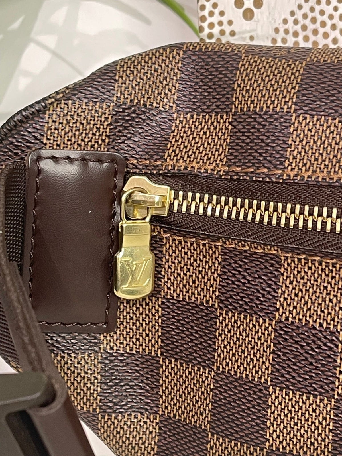 21. Louis Vuitton Damier Ebene Melville Bumbag