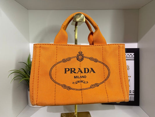 100. Prada Small Orange Canapa