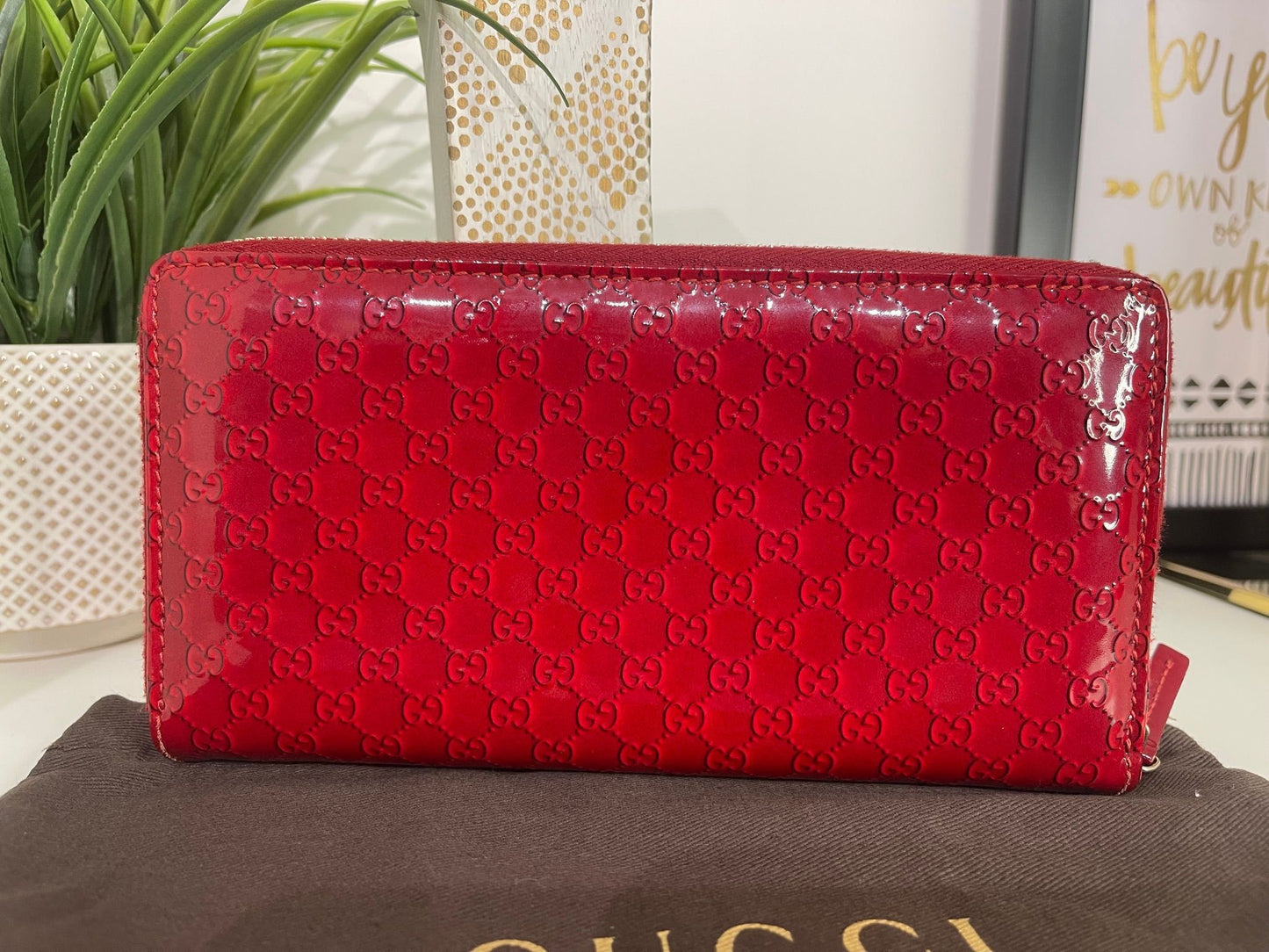 67. Gucci Red Patent Zippy Wallet