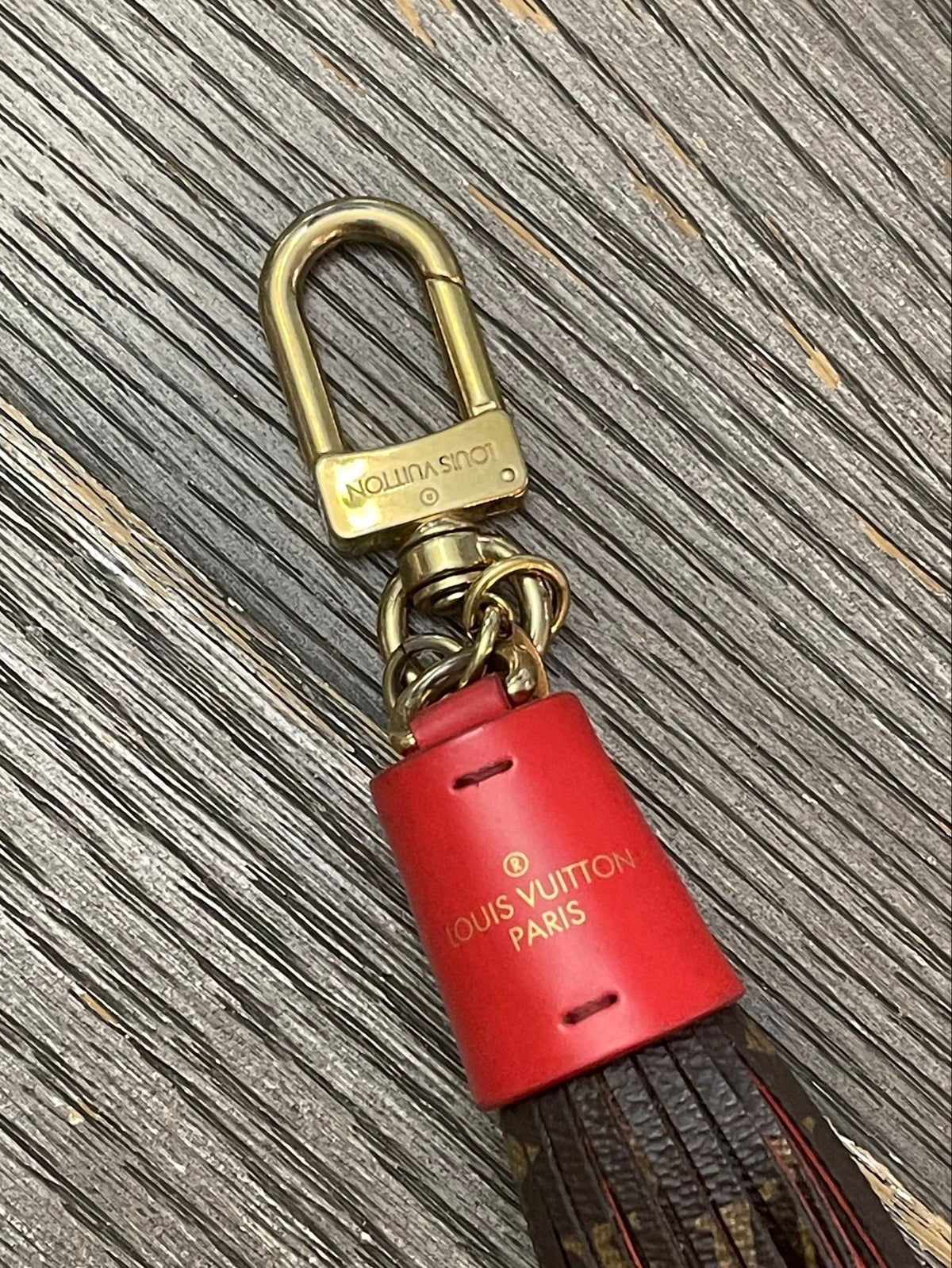 44. Louis Vuitton Tassel Charm Red/Monogram