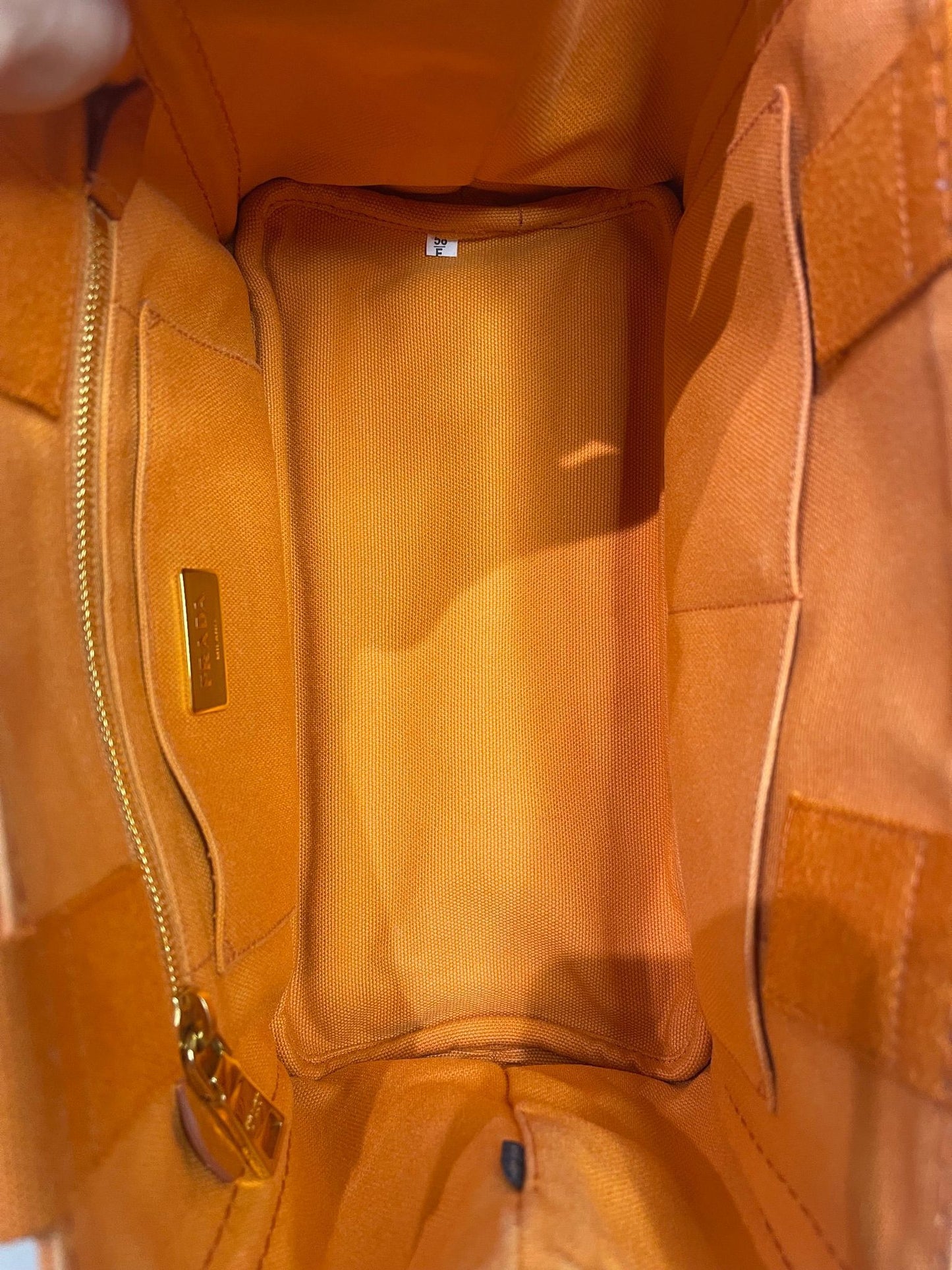 100. Prada Small Orange Canapa
