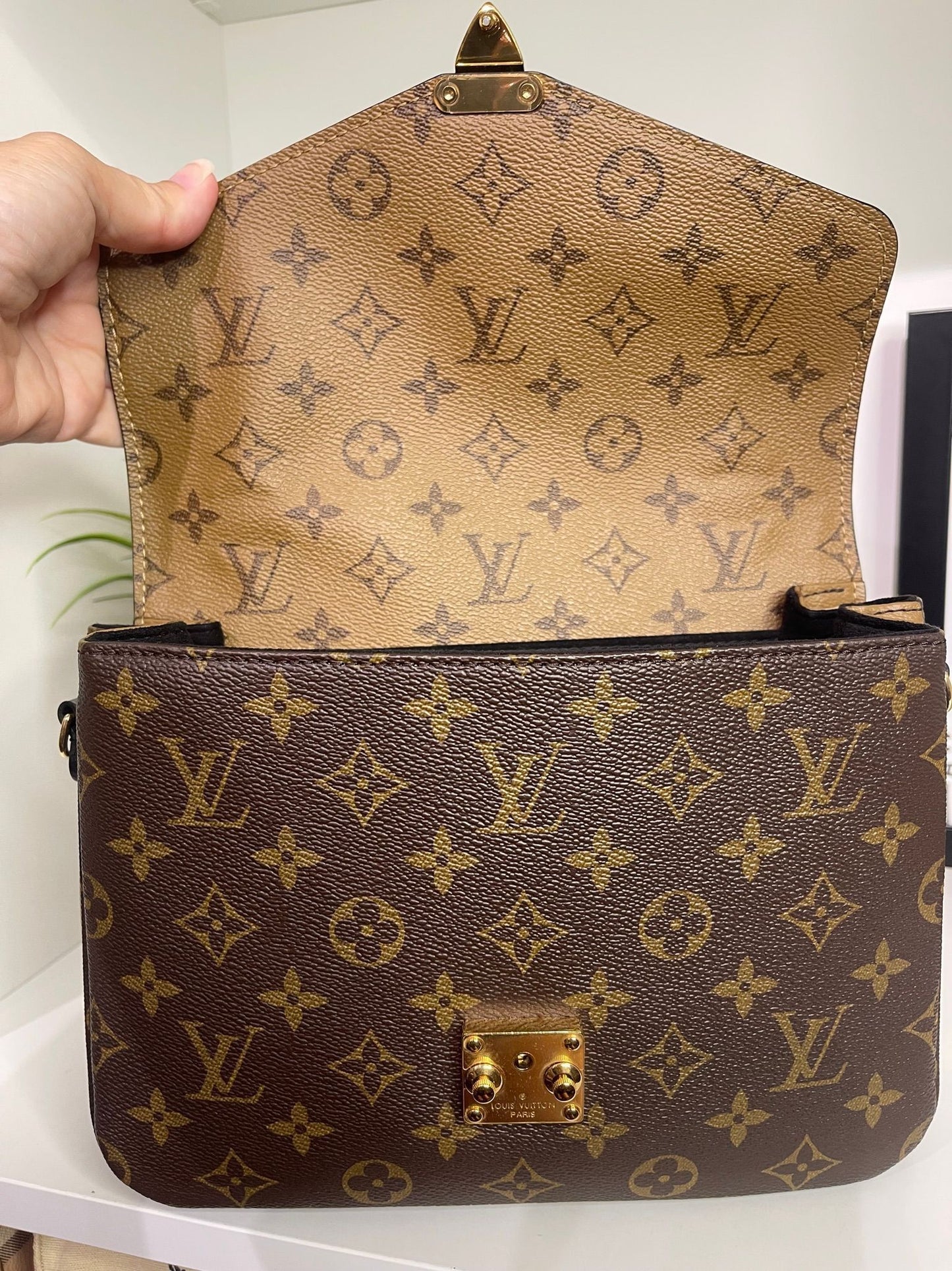 94. Louis Vuitton Reverse Monogram Pouchette Metis