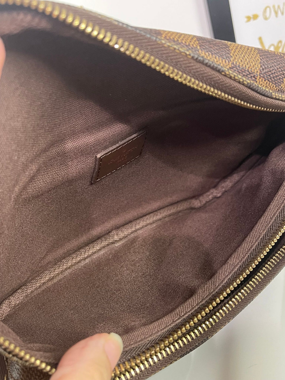 21. Louis Vuitton Damier Ebene Melville Bumbag