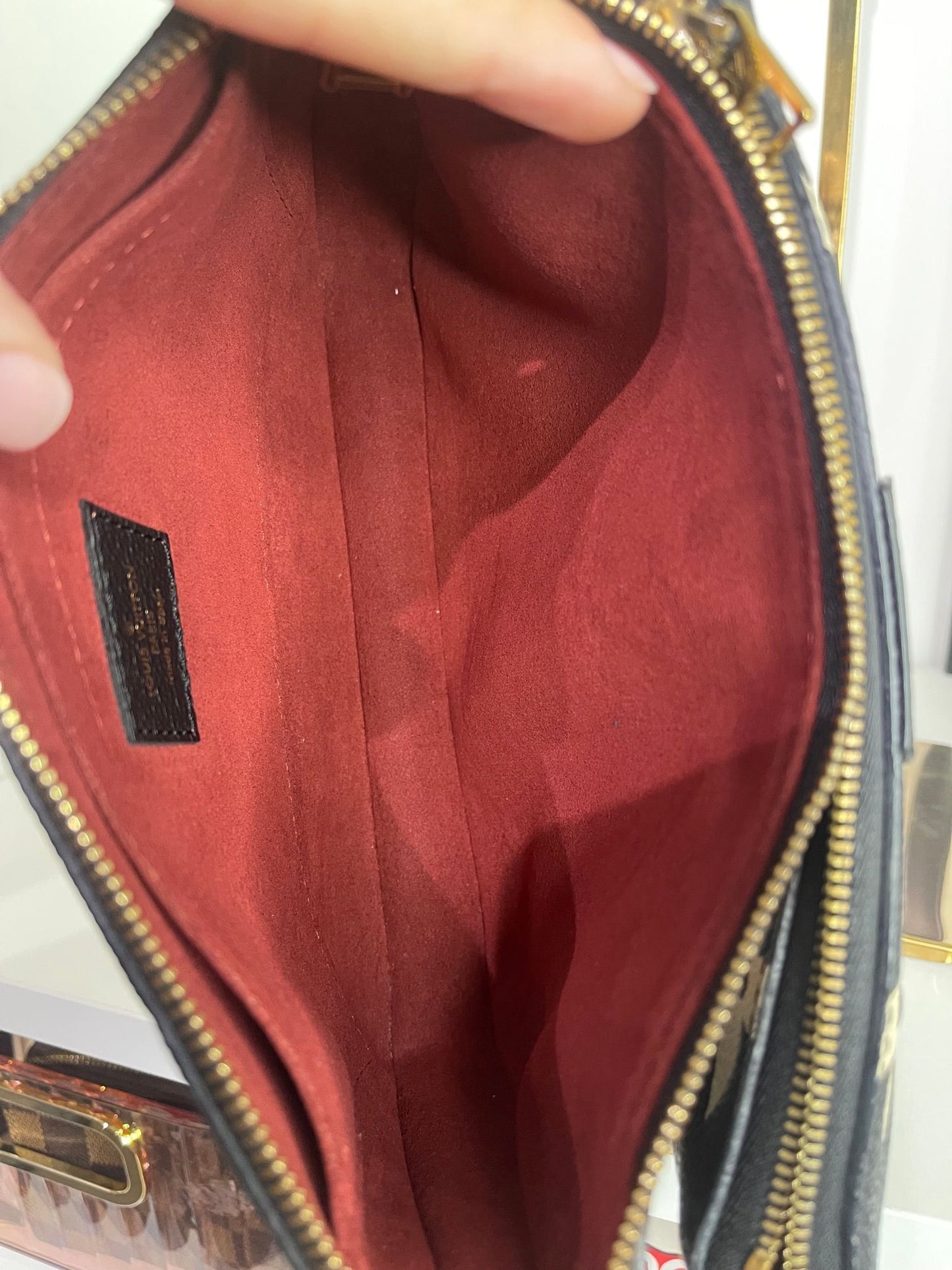 95. Louis Vuitton Multi Bicolor Pouchette