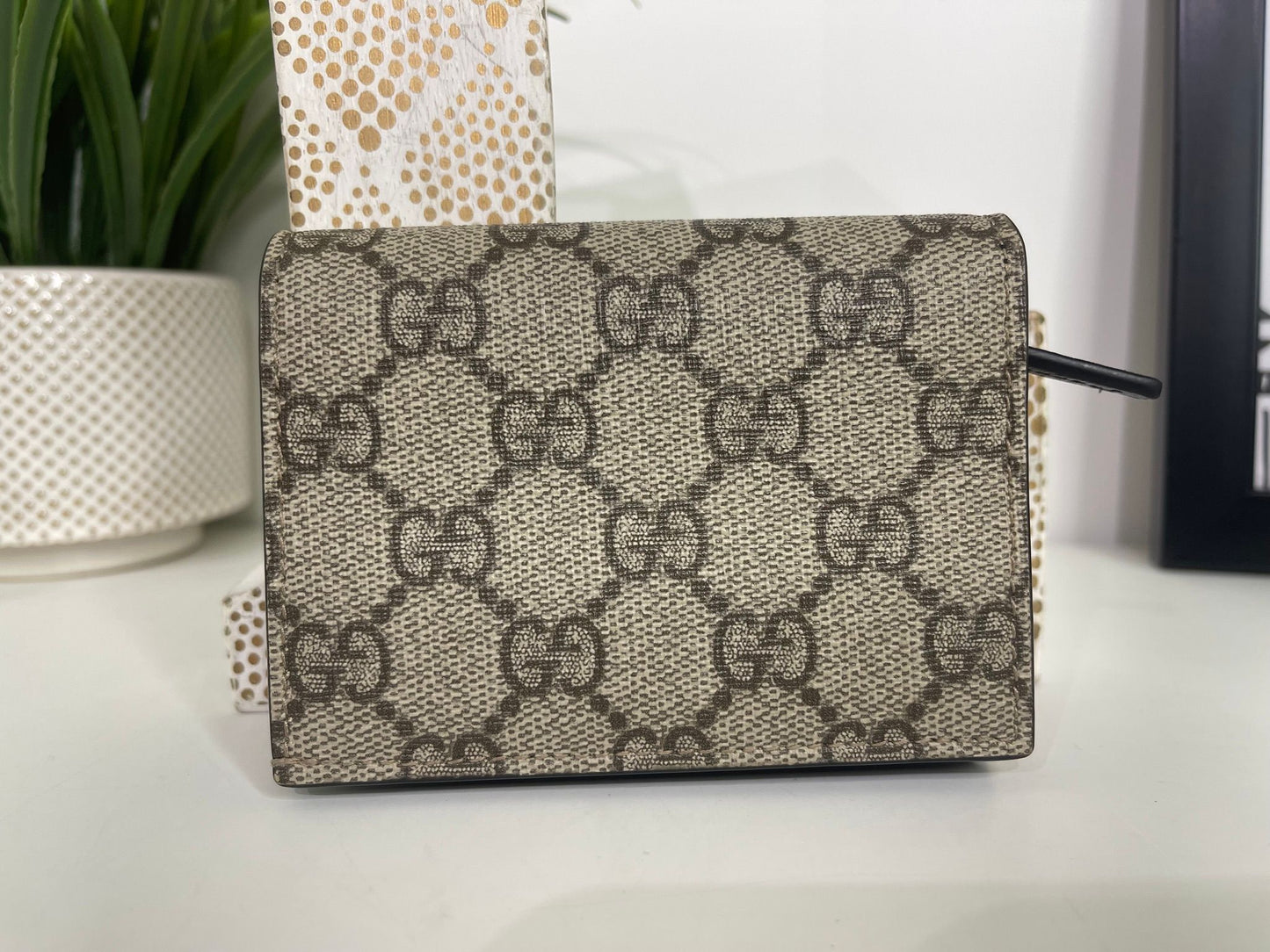 76. Gucci Supreme Compact Wallet Black Leather Trim