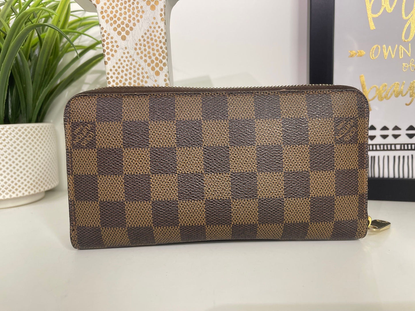 95. Louis Vuitton Damier Ebene Zippy Wallet