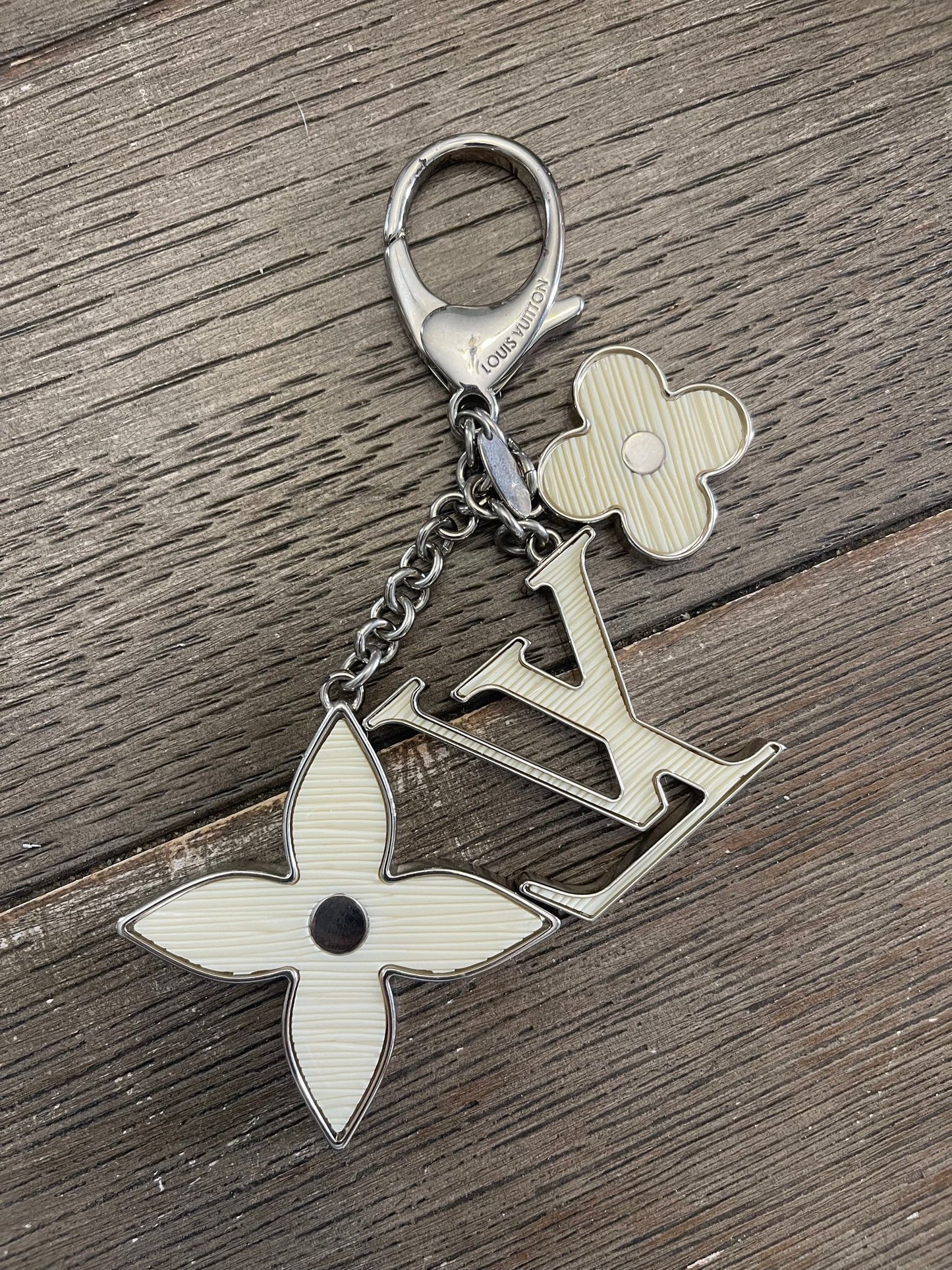22. Louis Vuitton Ivory Fleur D’Epi Bag Charm