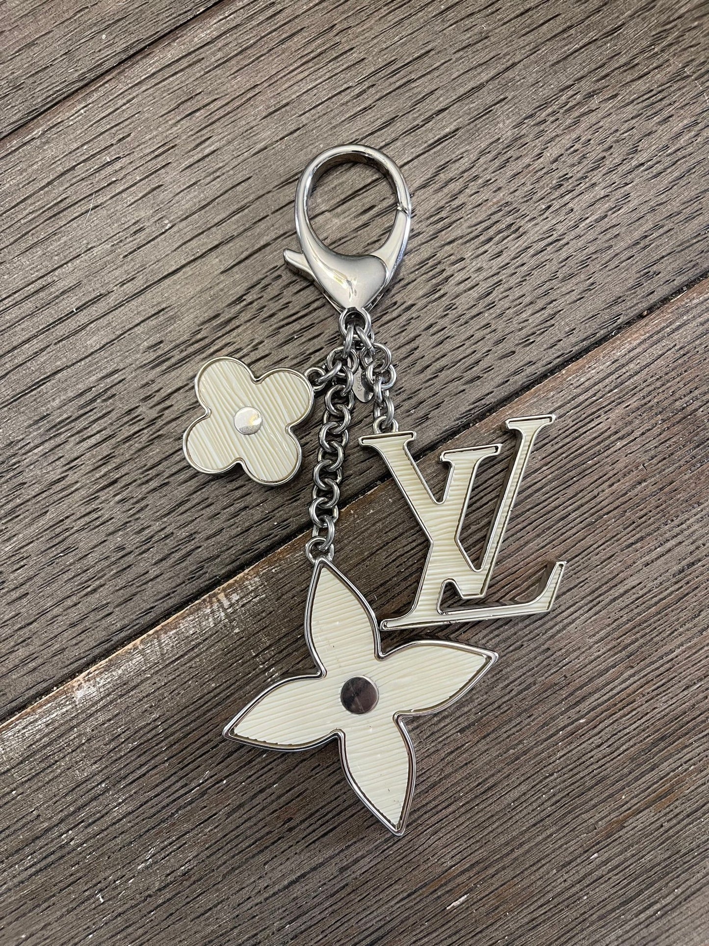 22. Louis Vuitton Ivory Fleur D’Epi Bag Charm