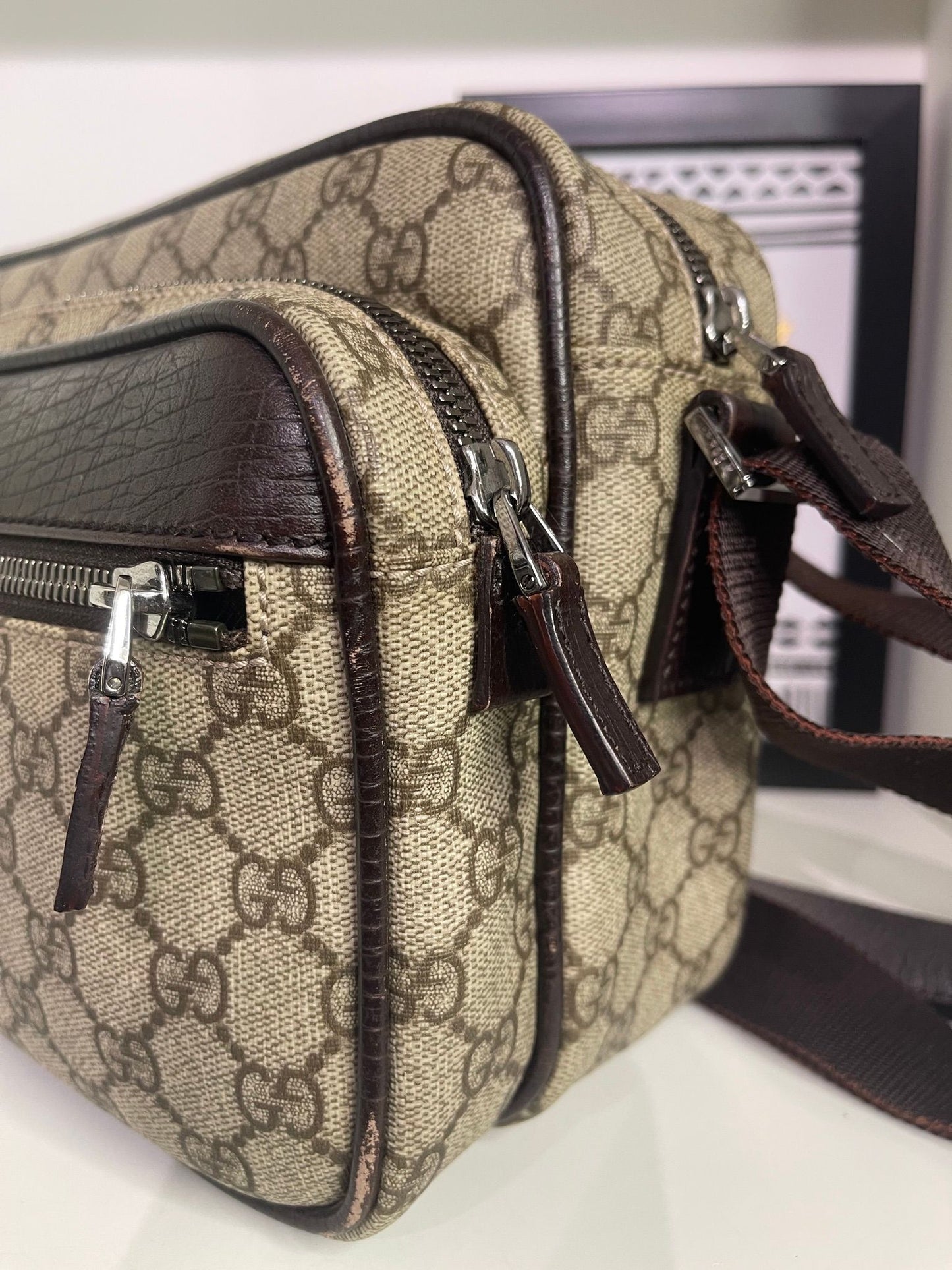 49. Gucci Supreme Crossbody Camera Bag