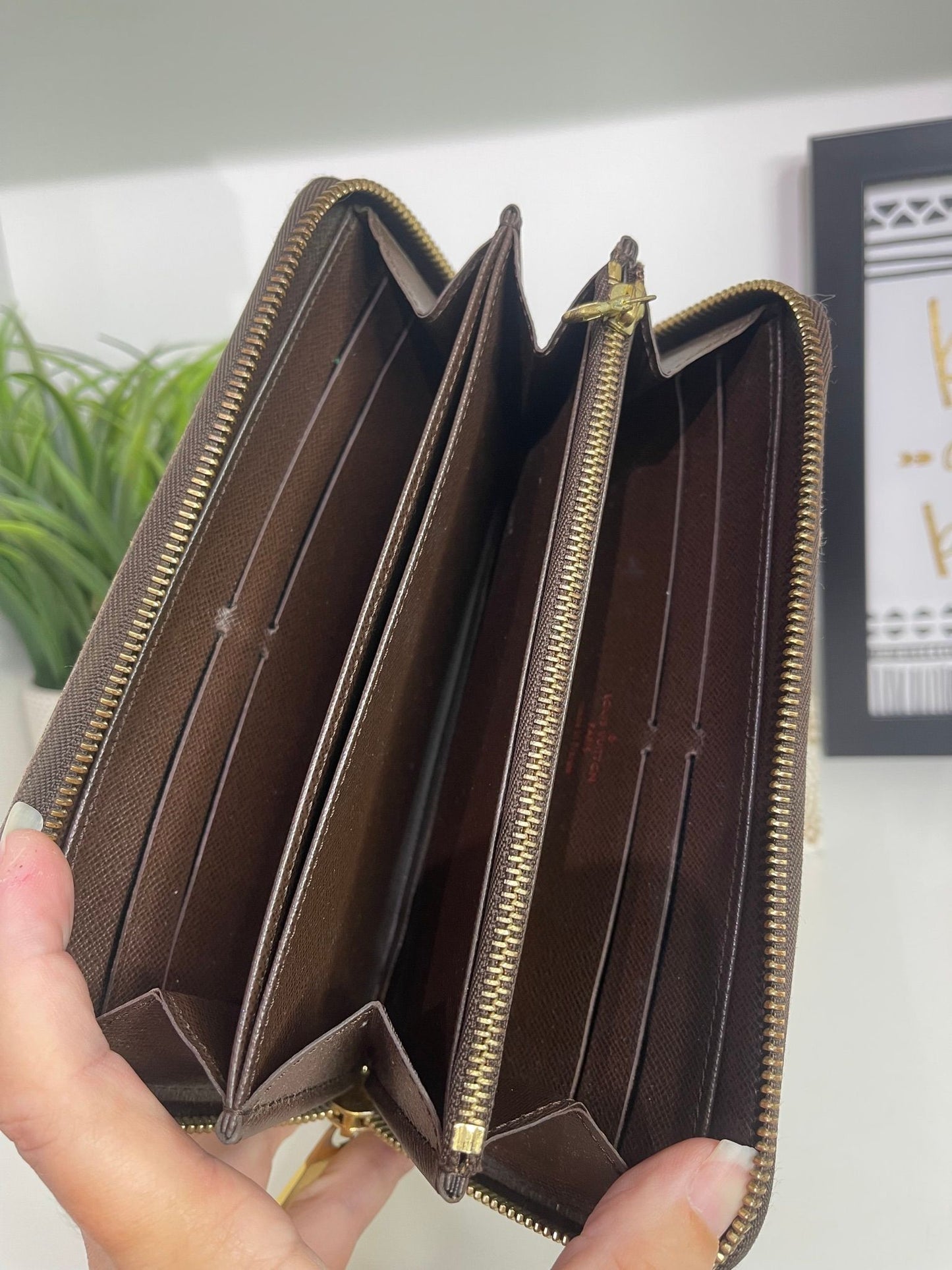 95. Louis Vuitton Damier Ebene Zippy Wallet