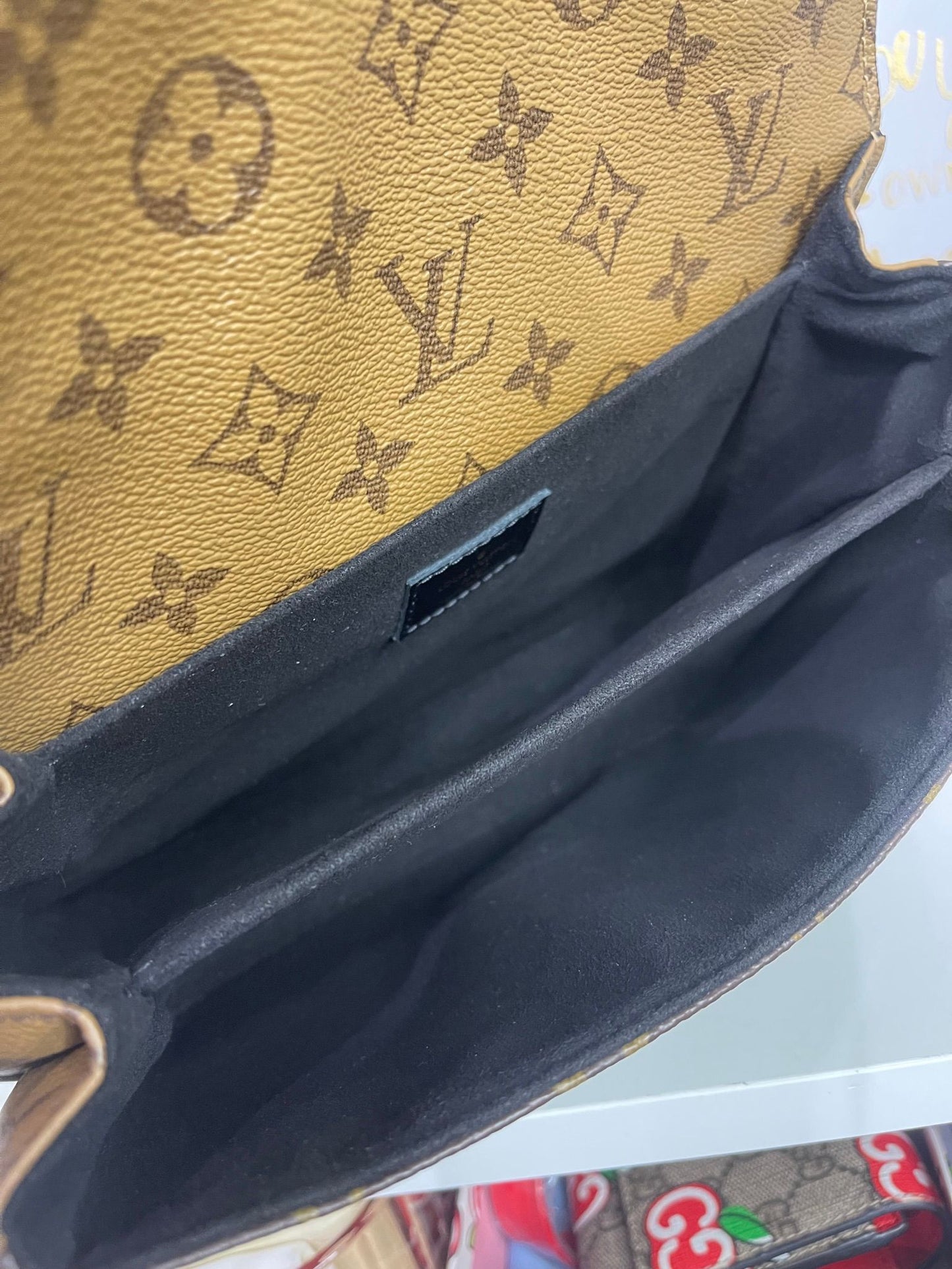 94. Louis Vuitton Reverse Monogram Pouchette Metis