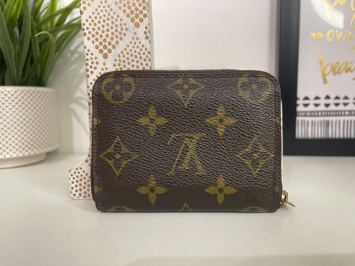 49. Louis Vuitton Monogram Zippy Card Holder