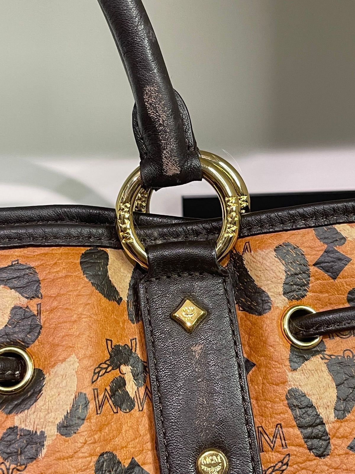 109. MCM Visetos Leopard Print Draw String Shoulder Bag
