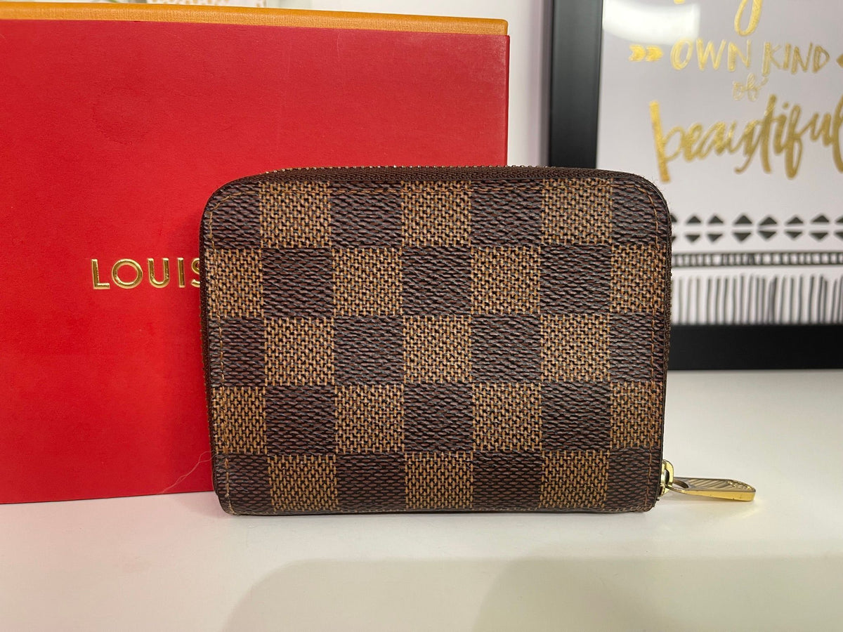 21. Louis Vuitton Damier Ebene Zippy Compact Wallet