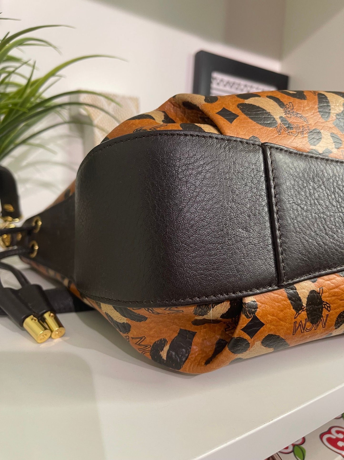 109. MCM Visetos Leopard Print Draw String Shoulder Bag