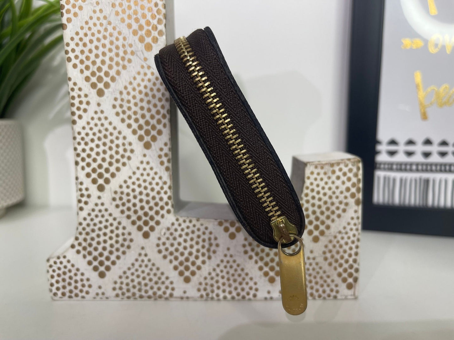 16. Louis Vuitton Damier Ebene Zippy Card Holder