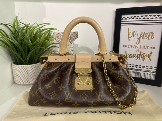 69. Louis Vuitton Monogram 2 Way Clutch