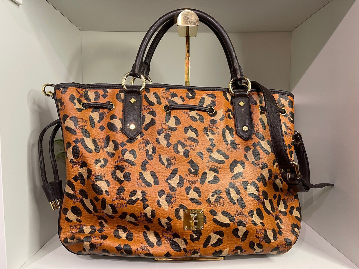 109. MCM Visetos Leopard Print Draw String Shoulder Bag