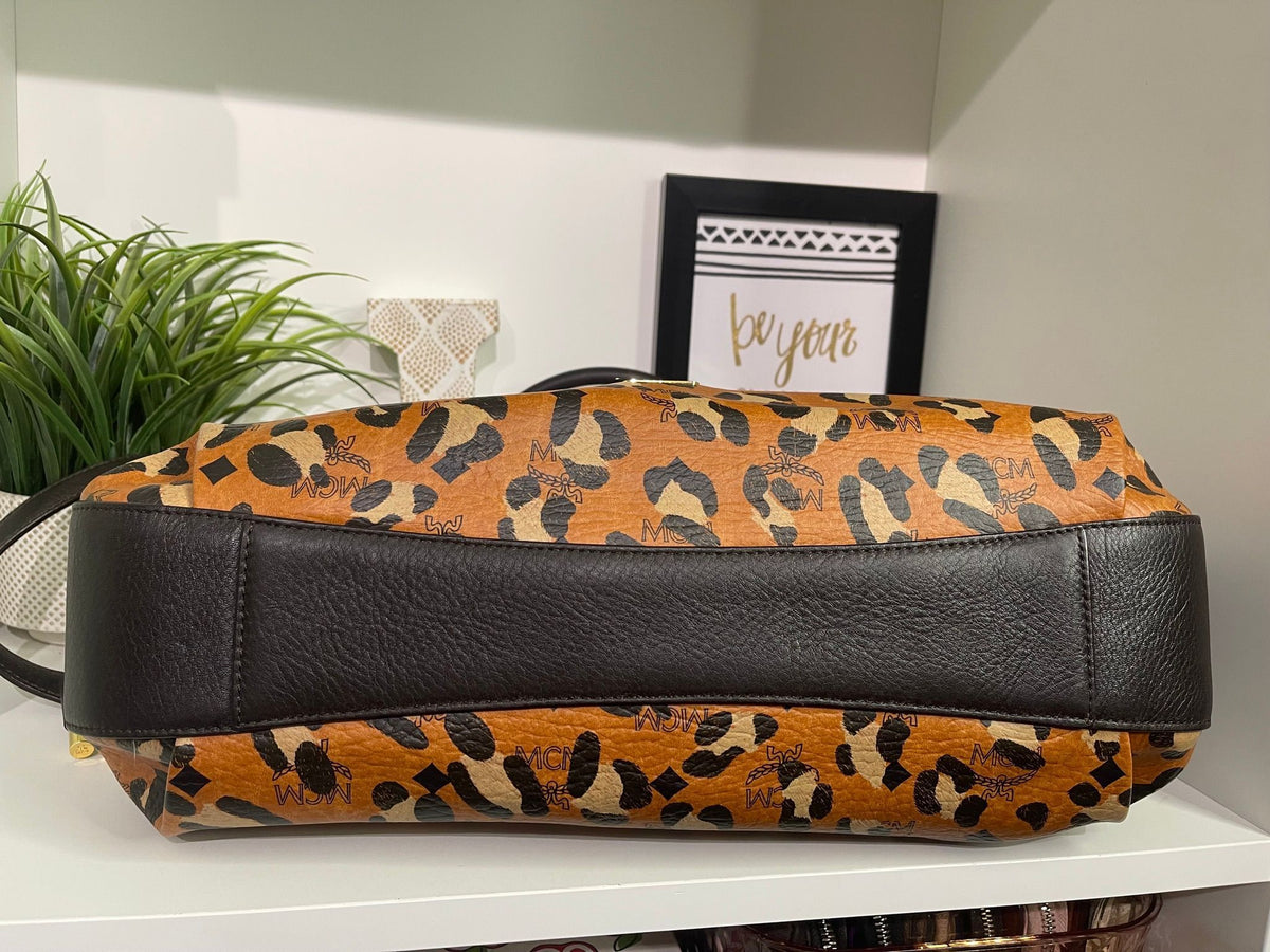 109. MCM Visetos Leopard Print Draw String Shoulder Bag