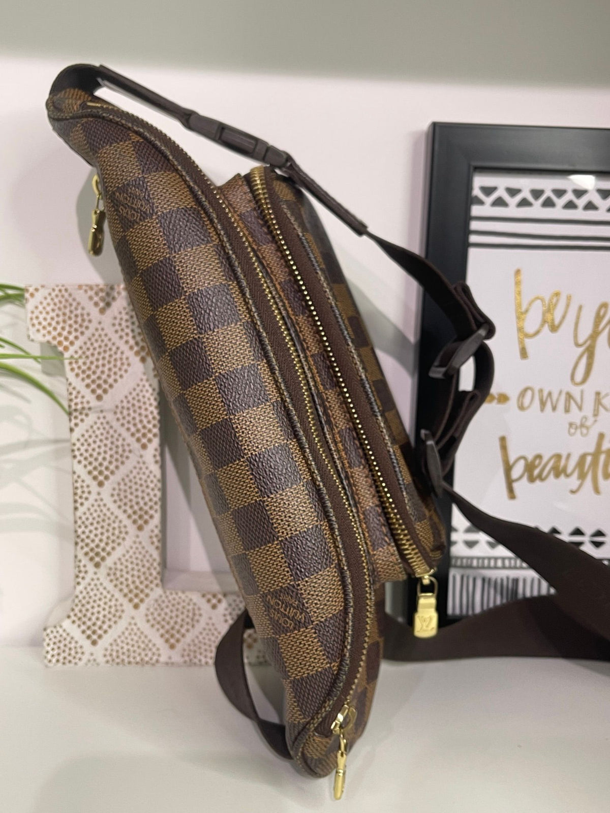 21. Louis Vuitton Damier Ebene Melville Bumbag