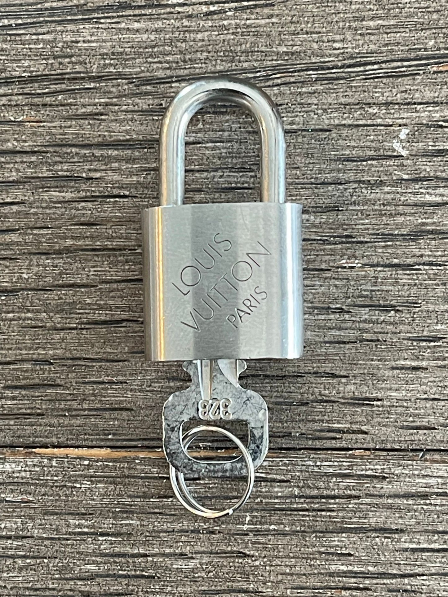 149. Louis Vuitton Silver Lock & Key #323