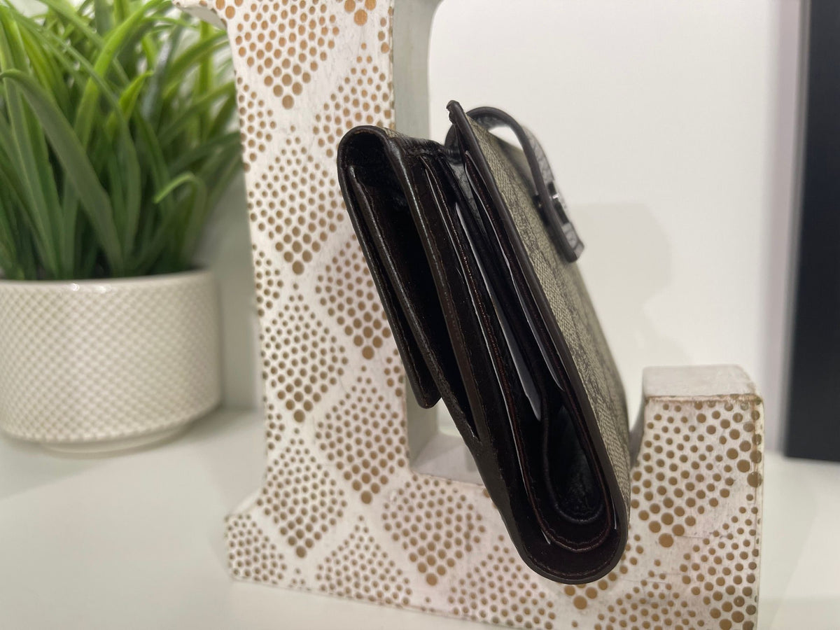 86. Gucci Supreme Compact Wallet