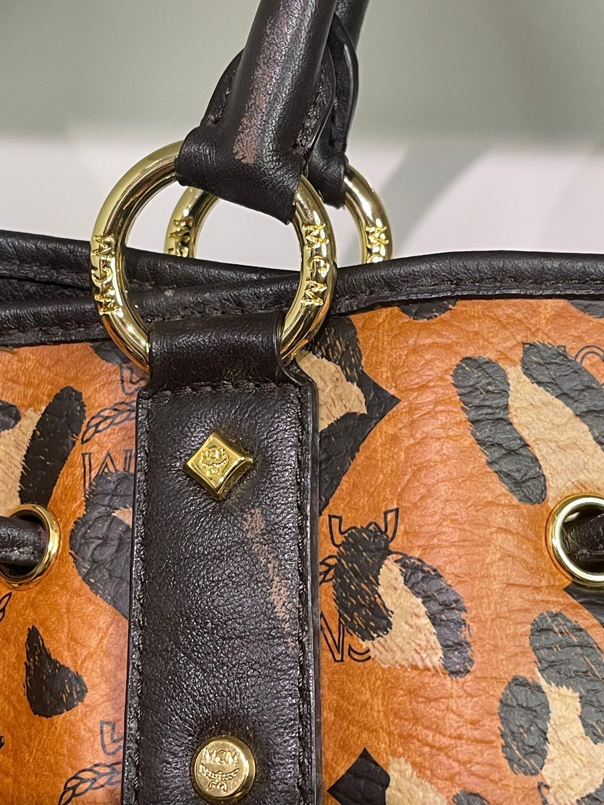 109. MCM Visetos Leopard Print Draw String Shoulder Bag
