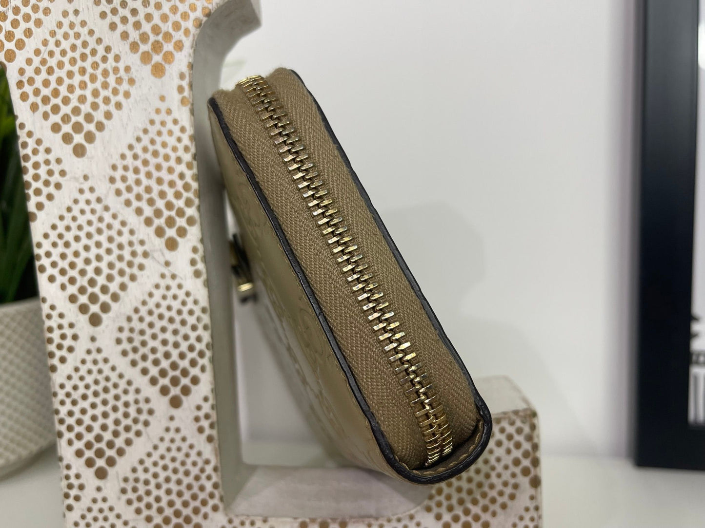 108. Gucci Metallic Gold Zippy Wallet