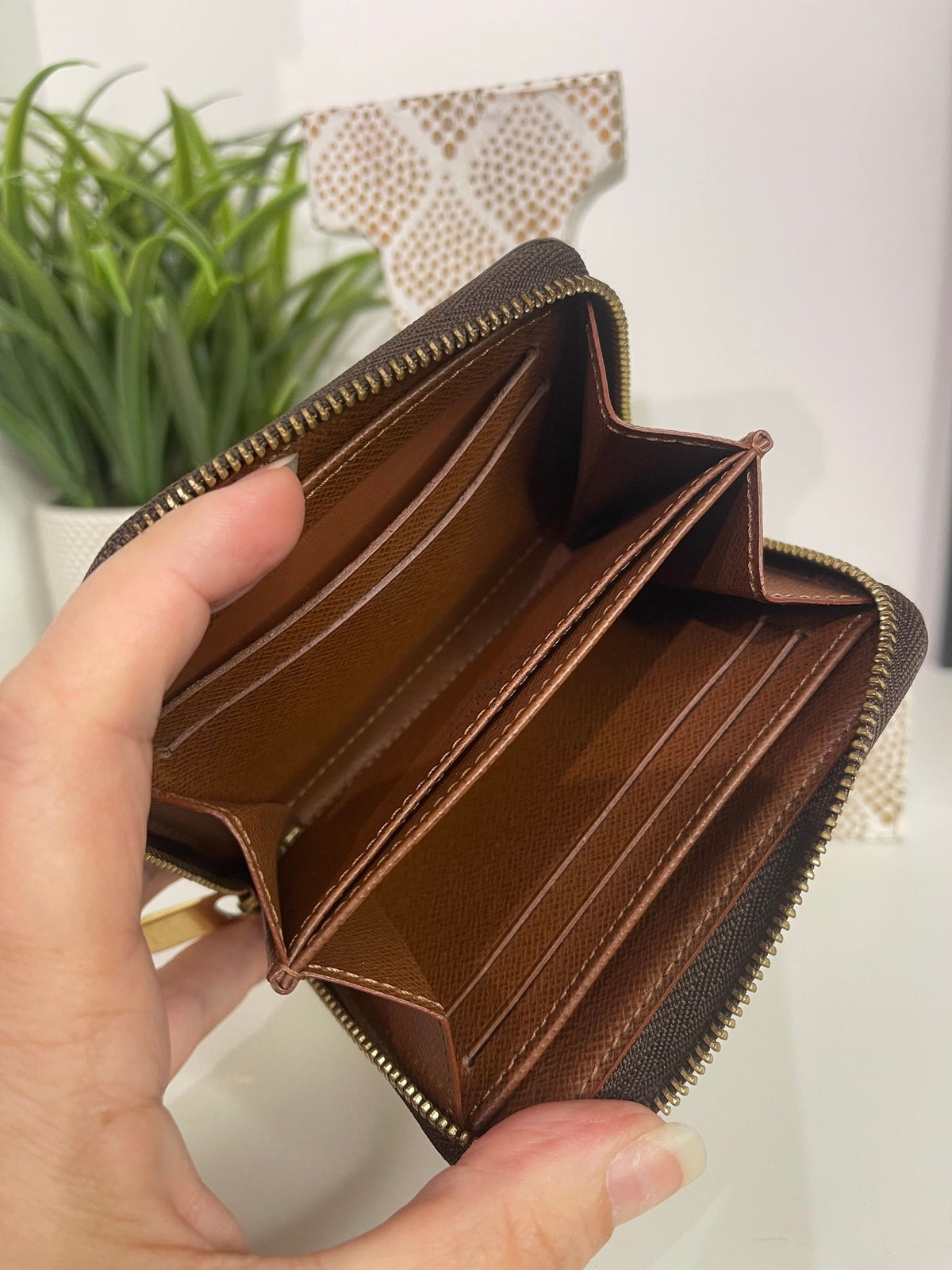 49. Louis Vuitton Monogram Zippy Card Holder