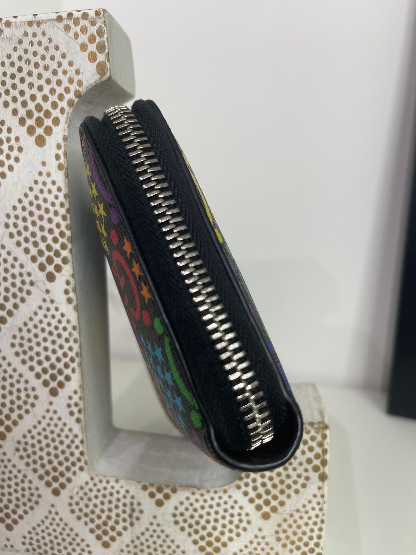 86. Gucci Psychedelic Zippy Wallet