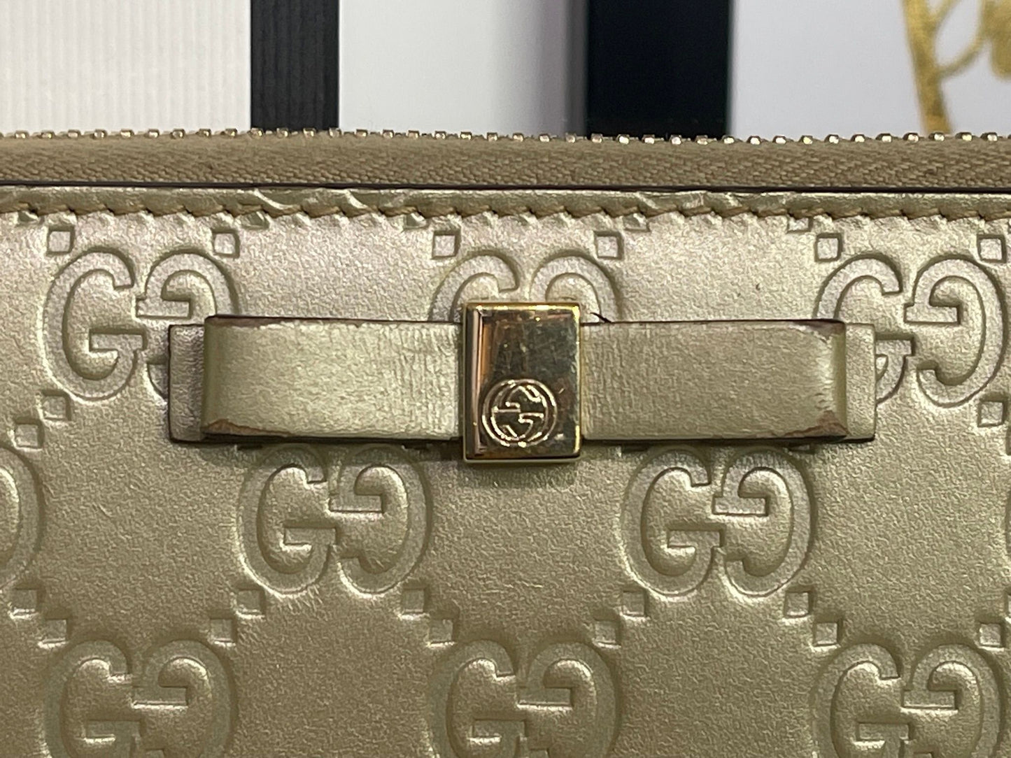 108. Gucci Metallic Gold Zippy Wallet