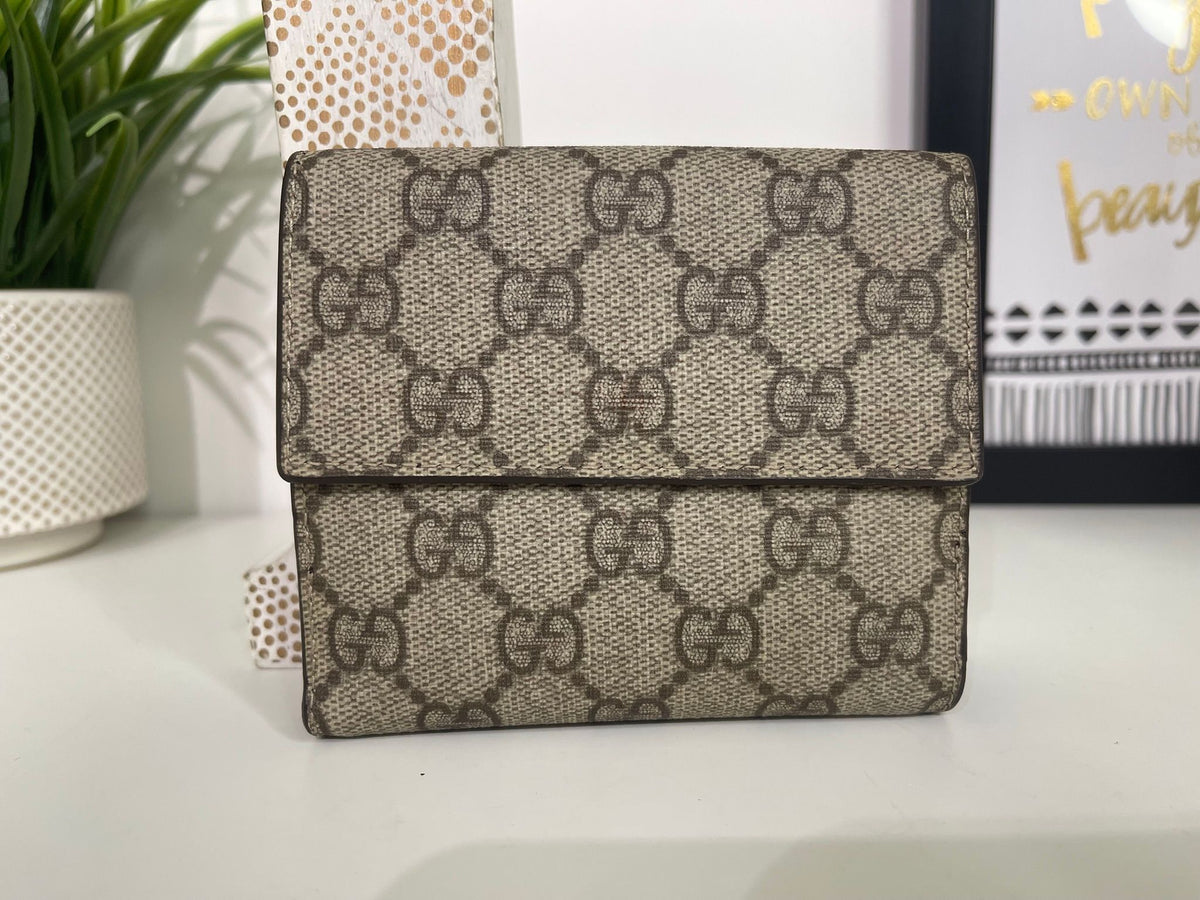 86. Gucci Supreme Compact Wallet