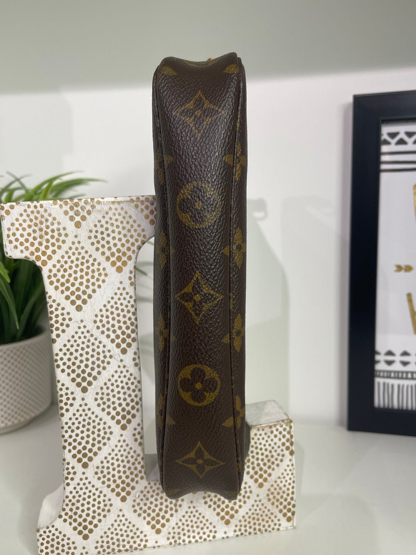 70. Louis Vuitton Monogram Pouchette