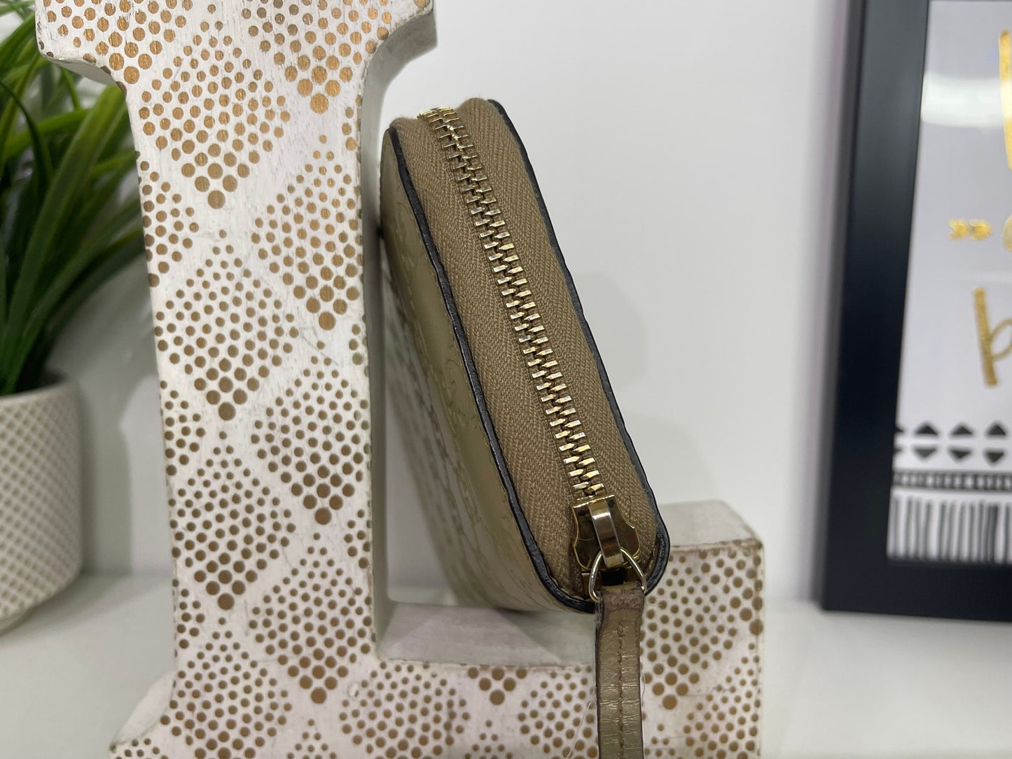 108. Gucci Metallic Gold Zippy Wallet