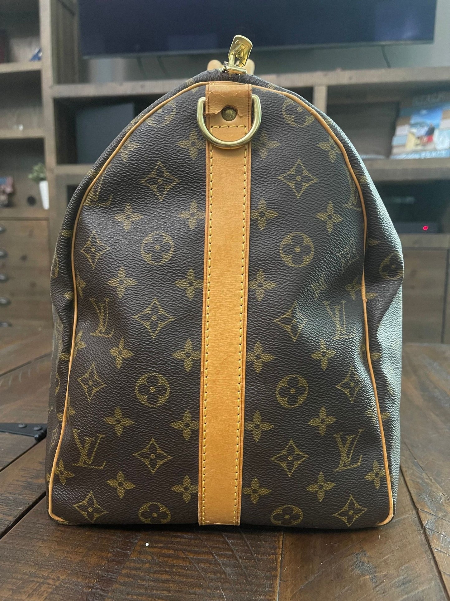 38. Louis Vuitton KeepAll 50 Bandolier (NO STRAP)