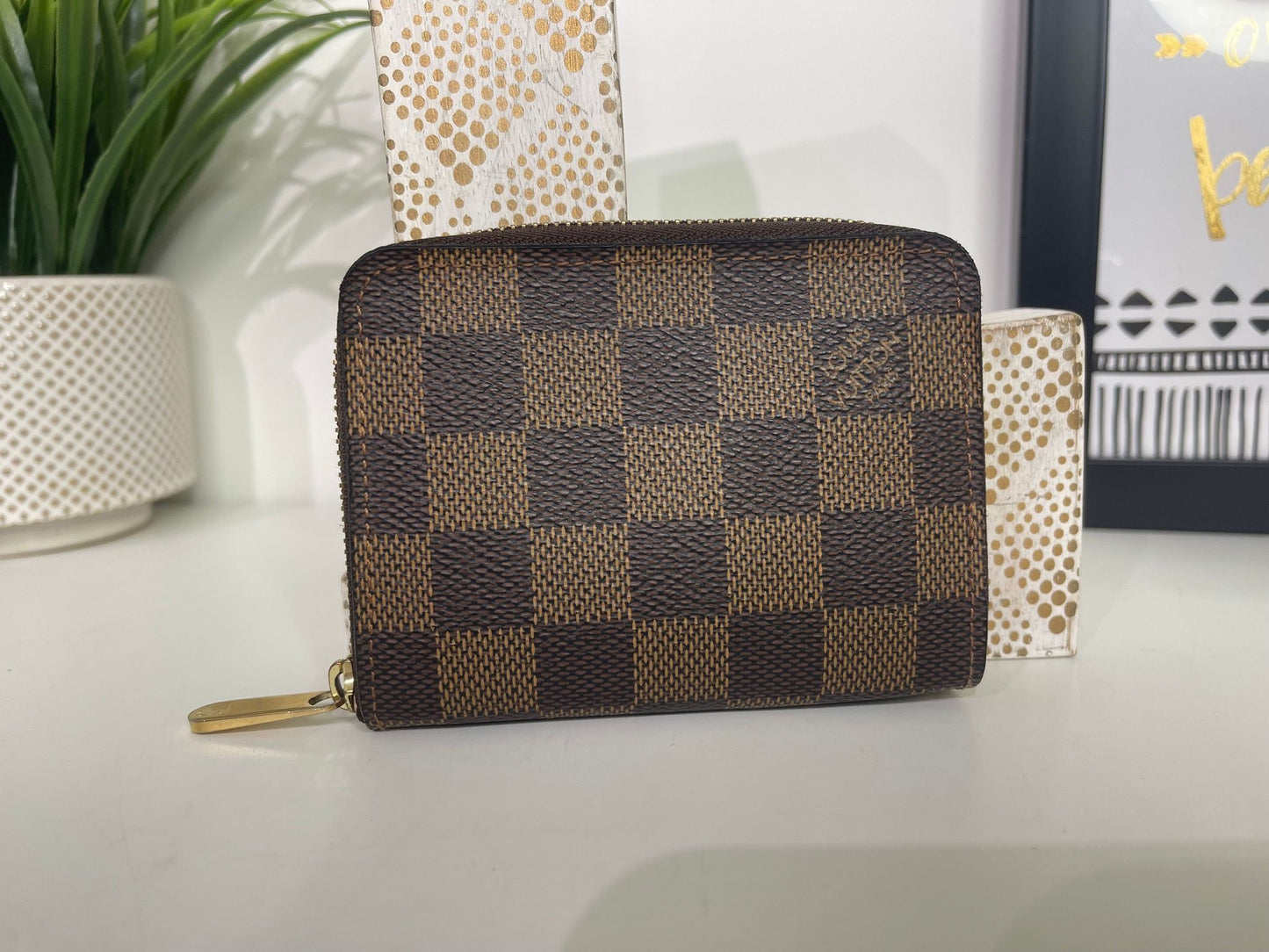 16. Louis Vuitton Damier Ebene Zippy Card Holder