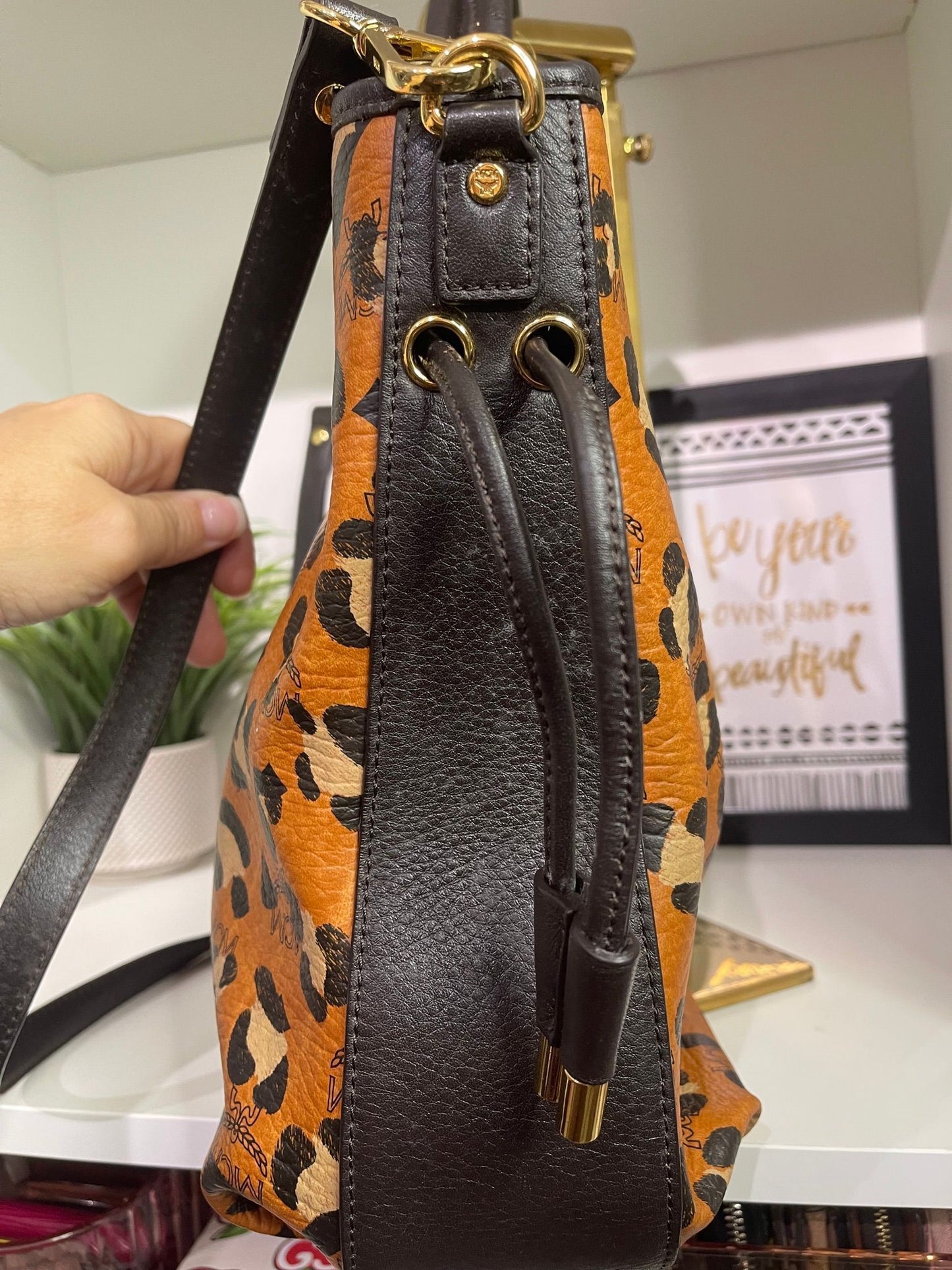109. MCM Visetos Leopard Print Draw String Shoulder Bag