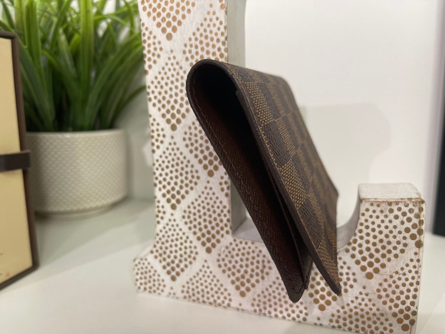 18. Louis Vuitton Damier Ebene Passport Holder