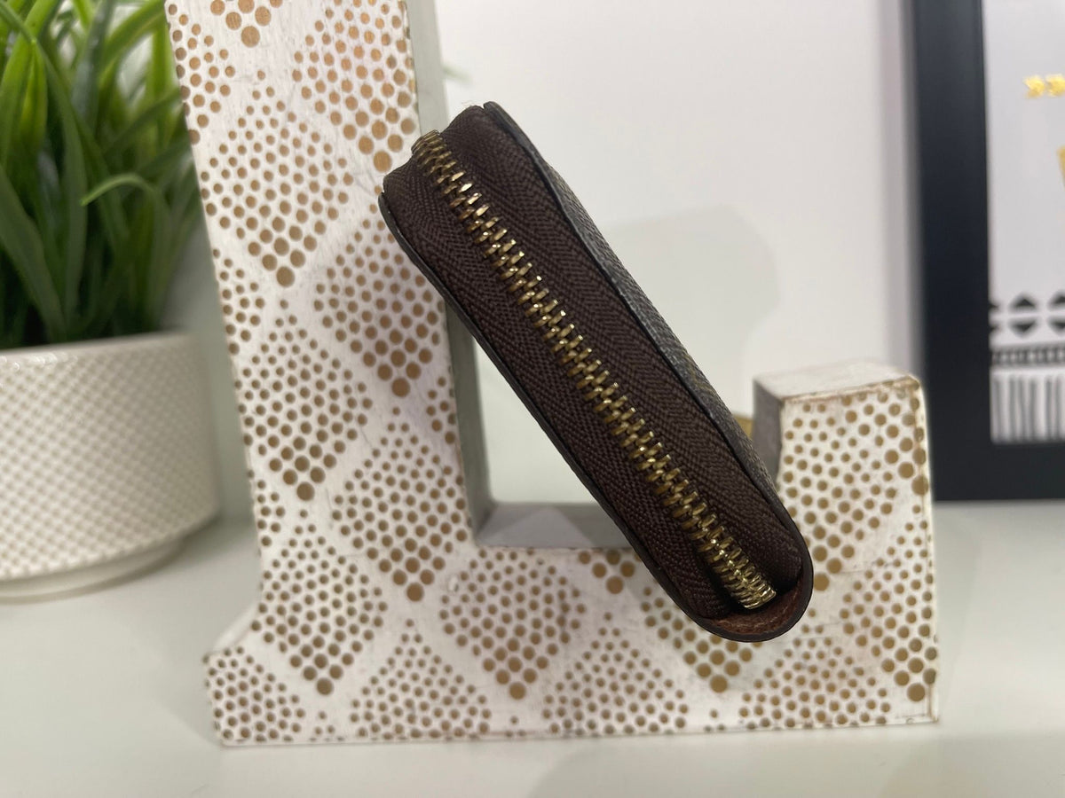 49. Louis Vuitton Monogram Zippy Card Holder