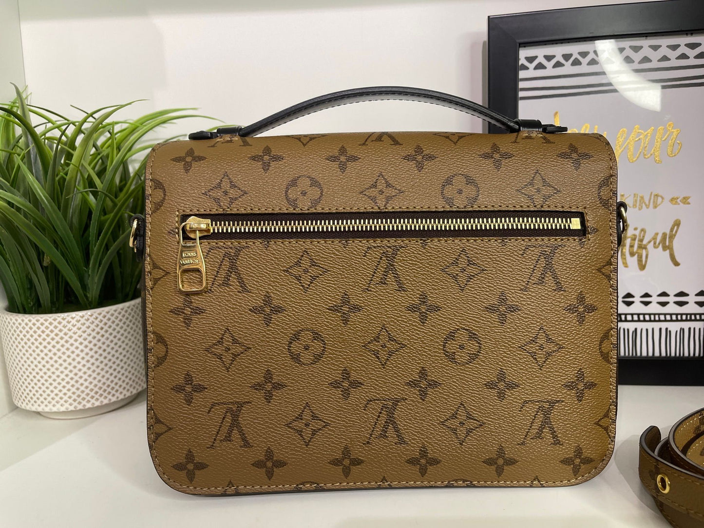 94. Louis Vuitton Reverse Monogram Pouchette Metis