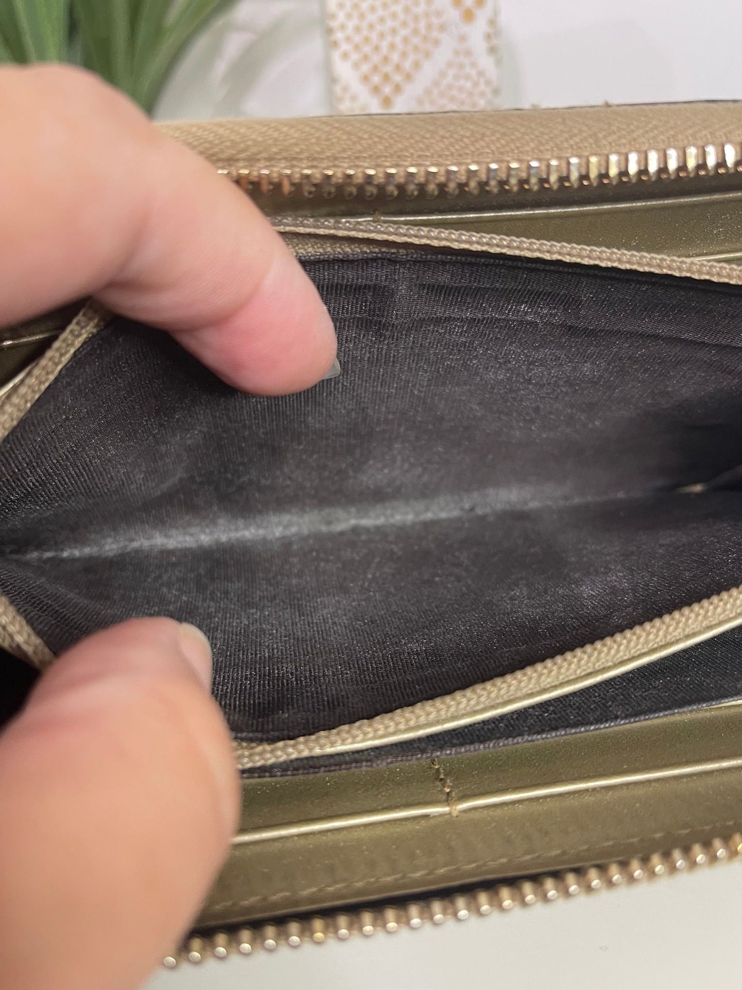 108. Gucci Metallic Gold Zippy Wallet