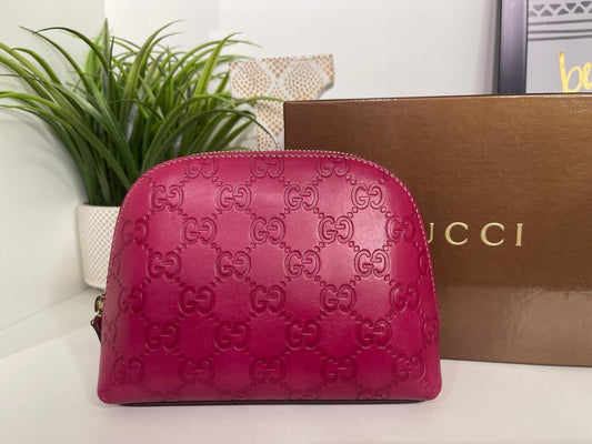 121. Gucci Fuscia Cosmetic Bag