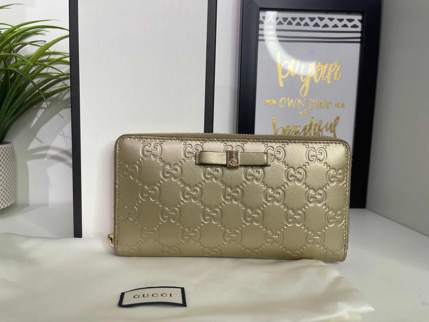 108. Gucci Metallic Gold Zippy Wallet