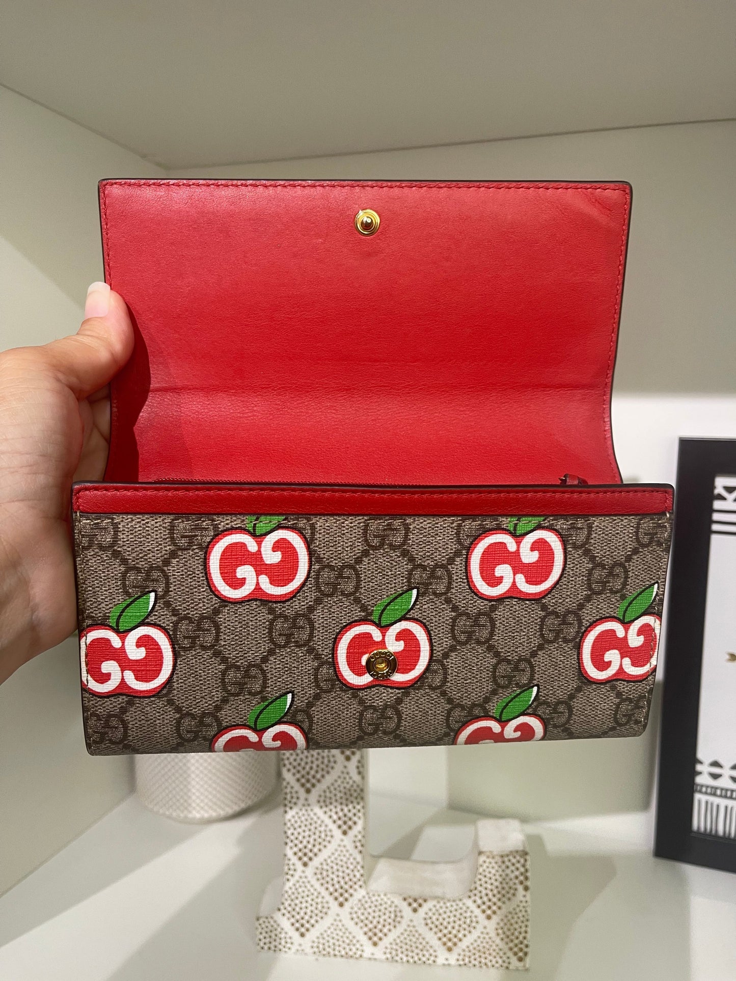 14. Gucci Supreme Apple Wallet