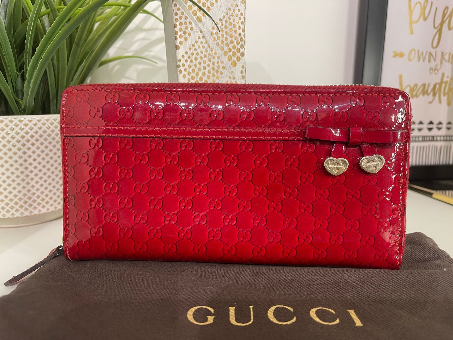 67. Gucci Red Patent Zippy Wallet